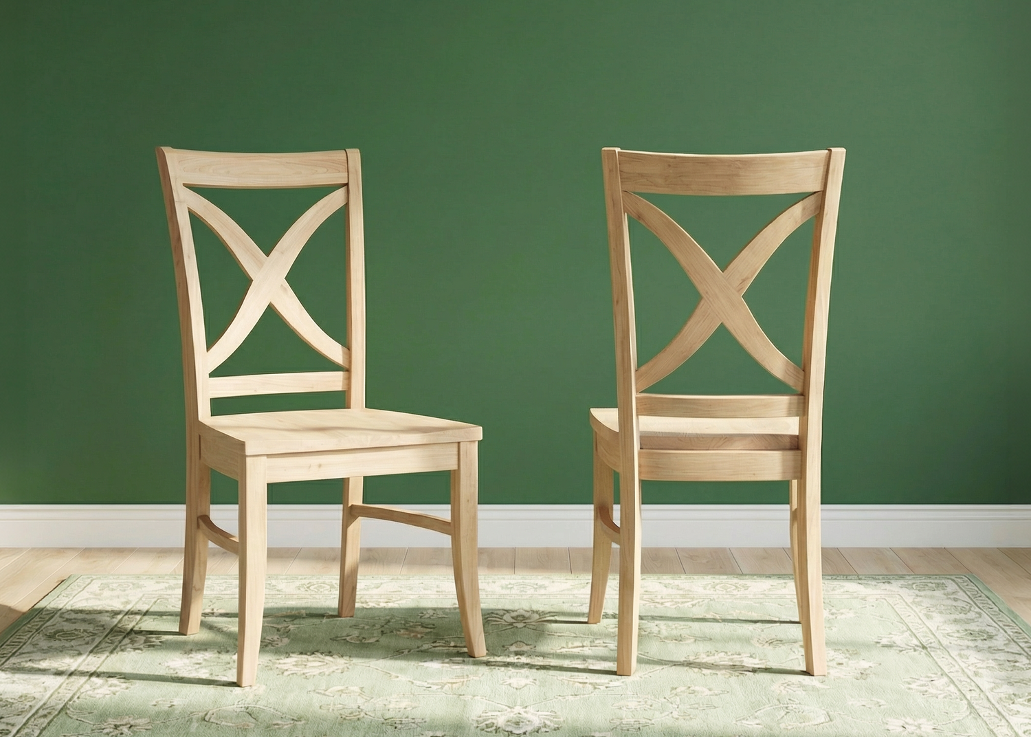 Two wooden chairs on a green rug against a green wall